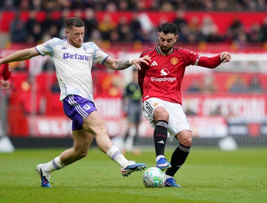 Manchester, England, 15th March 2026. Ross Barkley of Aston Villa tackles Bruno Fernandes of Manchester United, ManU during the Manchester United vs Aston Villa Premier League match at Old Trafford, Manchester. Picture credit should read: Andrew Yates Sportimage EDITORIAL USE ONLY. No use with unauthorised audio, video, data, fixture lists, club league logos or live services. Online in-match use limited to 120 images, no video emulation. No use in betting, games or single club league player publications. SPI_077_AY_Man_Utd_Villa SPI-4605-0074