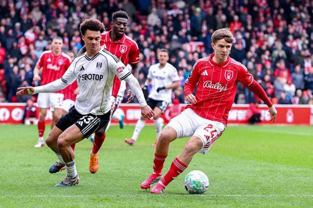 Nottingham Forest v Fulham, Premier League James McAtee of Nottingham Forest looks fro options under pressure from Antonee Robinson of Fulham during the Nottingham Forest v Fulham Premier League match at the City Ground, West Bridgford, England on 15 March 2026 Credit: Ryan Crockett Every Second Media Editorial use only. All images are copyright Every Second Media Limited. No images may be reproduced without prior permission. All rights reserved. Premier League and Football League images are subject to licensing agreements with Football DataCo Limited. see https: www.football-dataco.com Copyright: xIMAGO EveryxSecondxMediax ESM-1859-0080 RyanxCrockettx xEveryxSecondxMediax
