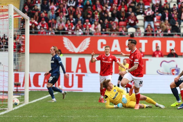 15.03.2026, xrekx, Fussball 2.Bundesliga, 1.FC Kaiserslautern - Karlsruher SC v.l. Torschuss zum 2:0 durch Mergim Berisha (1.FC Kaiserslautern) Hans Christian Bernat (Karlsruher SC) (DFL DFB REGULATIONS PROHIBIT ANY USE OF PHOTOGRAPHS as IMAGE SEQUENCES and or QUASI-VIDEO) Kaiserslautern