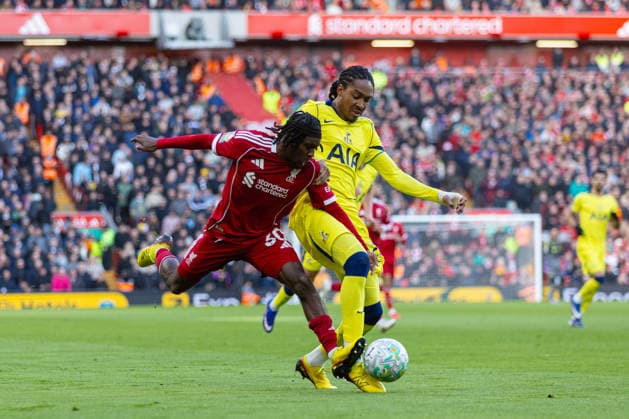 Football - FA Premier League - Liverpool FC v Tottenham Hotspur FC LIVERPOOL, ENGLAND - Sunday, March 15, 2026: Liverpool s Jeremie Frimpong is challenged by Tottenham Hotspur s Djed Spence (R) during the FA Premier League match between Liverpool FC and Tottenham Hotspur FC at Anfield. (Photo by David Rawcliffe Propaganda) LIVERPOOL Anfield MERSEYSIDE ENGLAND  Copyright: xDavidxRawcliffex P2026-03-15-Liverpool_Tottenham-49