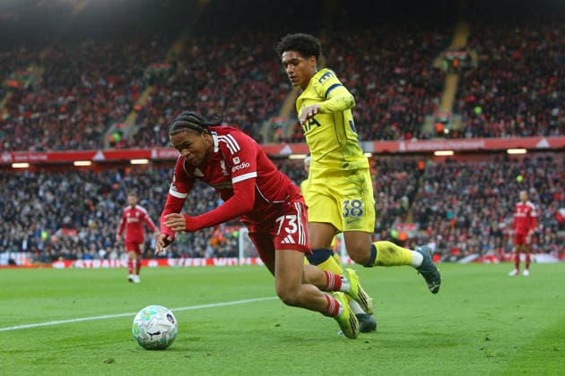 Souza of Tottenham sends Rio Ngumoha of Liverpool over Liverpool v Tottenham Hotspur, Premier League, Football, Anfield, Liverpool, UK - 15 Mar 2026Liverpool Anfield United Kingdom EDITORIAL USE ONLY No use with unauthorised audio, video, data, fixture lists, club league logos or live services. Online in-match use limited to 120 images, no video emulation. No use in betting, games or single club league player publications. Copyright: xPhilxOldham Shutterstockx 16757322au