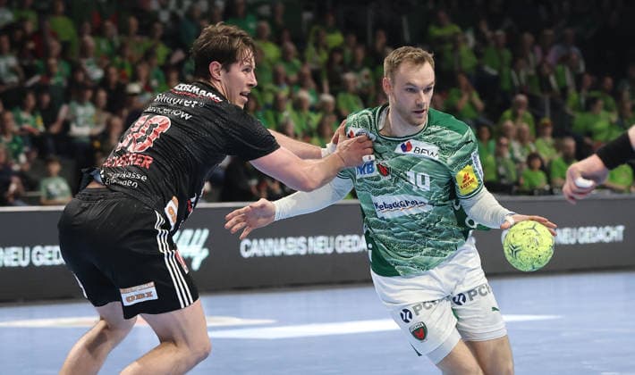 Florian Scheerer, Mathias Gidsel Zweikampf Spielszene Aktion Handball HBL Bundesliga Herren 25. Spieltag Saison 2025 2026 15.03.2026 Füchse Berlin vs. HC Erlangen HCE