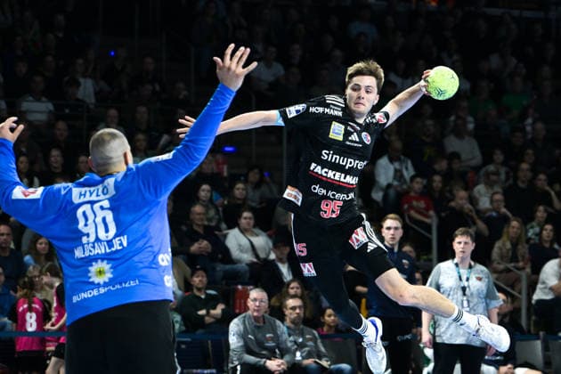 15.03.2026, xlakx, Handball Daikin HBL, Fuechse Berlin - HC Erlangen v.l. Dejan Milosavljev (Fuechse Berlin), Tim Goemmel (HC Erlangen) erzielt Tor Berlin