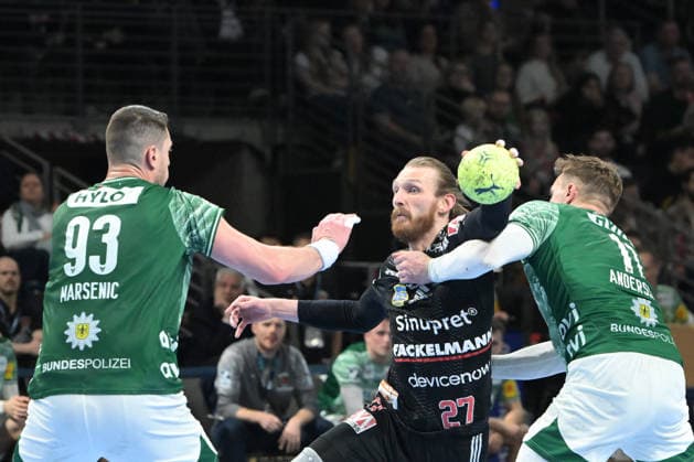 15.03.2026, xlakx, Handball Daikin HBL, Fuechse Berlin - HC Erlangen v.l. Mijajlo Marsenic (Fuechse Berlin), Antonio Metzner (HC Erlangen), Lasse Andersson (Fuechse Berlin) Zweikampf, Duell, Kampf, tackle Berlin