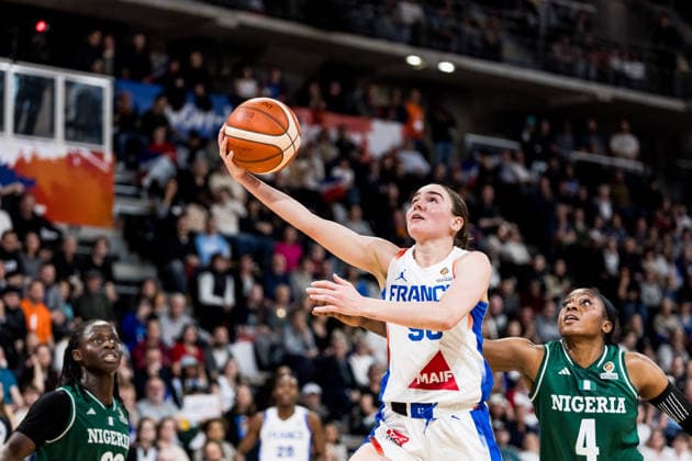 LYON-VILLEURBANNE, FRANCE - MARCH 15: Pauline Astier (France, 98) shoots the ball against Elizabeth Balogun (Nigeria, 4) during the FIBA Women™s World Cup Qualifying Tournament match between France (FRA) vs. Nigeria (NGR) at Astroballe on matchday 4 of the FIBA Women™s World Cup Qualifying Tournament on March 15, 2026 in Lyon-Villeurbanne, France. France Copyright: xSteffiexWunderlx