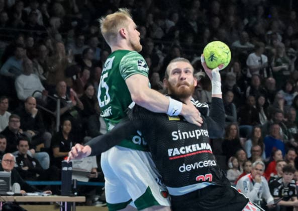 15.03.2026, xlakx, Handball Daikin HBL, Fuechse Berlin - HC Erlangen v.l. Matthes Langhoff (Fuechse Berlin), Antonio Metzner (HC Erlangen) setzt zum Wurf an Berlin
