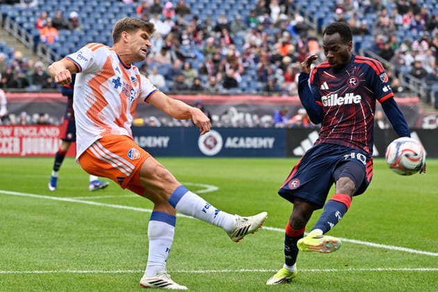 March 15, 2026; Foxborough, Massachusetts; FC Cincinnati defender Nick Hagglund (4) passes the ball by New England Revolution midfielder Alhassan Yusuf (80) during the first half at Gillette Stadium. CSM Foxborough USA - ZUMAc04_ 20260315_faf_c04_009 Copyright: xEricxCanhax