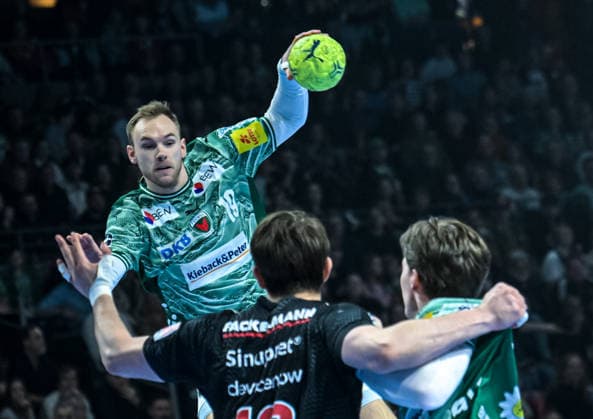 15.03.2026, xlakx, Handball Daikin HBL, Fuechse Berlin - HC Erlangen v.l. Mathias Gidsel (Fuechse Berlin), Florian Scheerer (HC Erlangen), Nils Lichtlein (Fuechse Berlin) Berlin