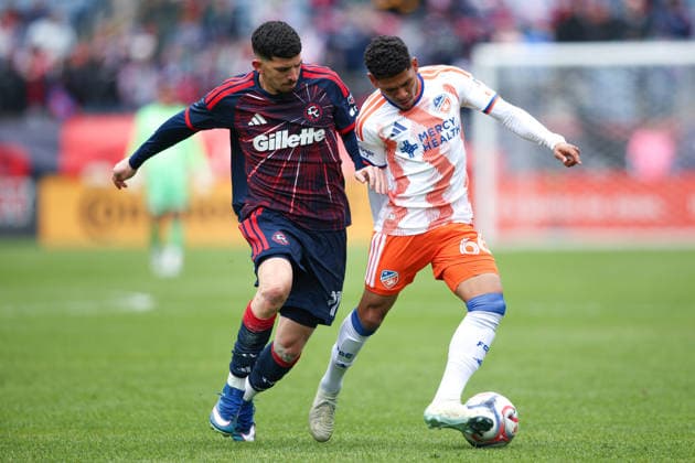 March 15, 2026; Foxborough, Massachusetts, USA; FC Cincinnati forward Ender Echenique (66) keeps the ball away from New England Revolution forward Dor Turgeman (11) in a Major League Soccer game between the New England Revolution and FC Cincinnati at Gillette Stadium. (c) CSM MLS, Fussball Herren, USA 2026: FC Cincinnati Vs Revolution MAR 15  - ZUMAc04_ 20260315_zma_c04_022 Copyright: xBurtxGranofskyx