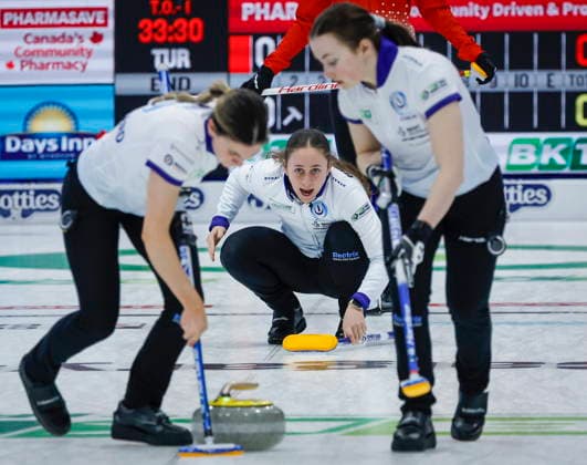 March 15, 2026, Calgary, Ab, CANADA: Scotland s skip Fay Henderson, centre, delivers a stone against Turkey as alternate Laura Watt, left, and lead Katie McMillan sweep at the World Women™s Curling Championship in Calgary, Sunday, March 15, 2026. Katie McMillan, Laura Watt, Fay Henderson  - ZUMAc35_ 20260315_zaf_c35_154 Copyright: xJeffxMcintoshx