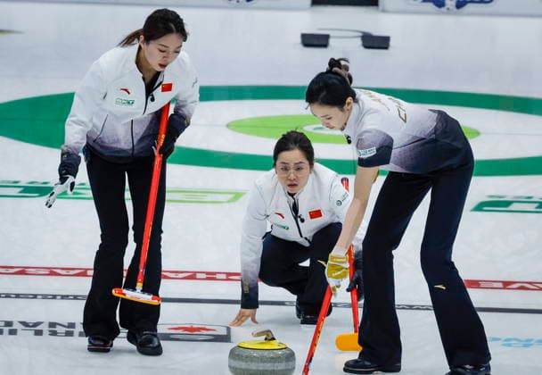 March 15, 2026, Calgary, Ab, CANADA: China s skip Yu Han, centre, delivers a stone against Team Canada as fourth Rui Wang, left, and lead Jiayi Jiang sweep at the World Women™s Curling Championship in Calgary, Sunday, March 15, 2026. Rui Wang, Yu Han, Jiayi Jiang  - ZUMAc35_ 20260315_zaf_c35_186 Copyright: xJeffxMcintoshx