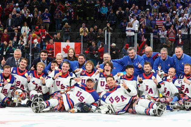 March 15, 2026, Milan, Lombardy, Italy: Team USA players of whom hat-trick goal scorer JACK WALLACE, tournament Mvp DECLAN FARMER, captain JOSH PAULS, goalie GRIFFIN LAMARRE and coach DAVID HOFF celebrate with their gold medals after the Final game between Team United States (USA) and Team Canada (CAN) at the Milano Cortina 2026 Paralympic Winter games, Winterspiele,Spiele, Summer games Team USA won 6:2 and their fifth consecutive Para Ice hockey, Eishockey Milan Italy - ZUMAc179 20260315_oly_c179_130 Copyright: xMickaelxChavetx