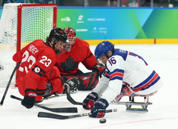 March 15, 2026, Milan, Lombardy, Italy: DECLAN FARMER 16 of USA attacks in the Final game between Team United States (USA) and Team Canada (CAN) at the Milano Cortina 2026 Paralympic Winter games, Winterspiele,Spiele, Summer games Team USA won 6:2 and their fifth consecutive Para Ice hockey, Eishockey Milan Italy - ZUMAc179 20260315_oly_c179_162 Copyright: xMickaelxChavetx