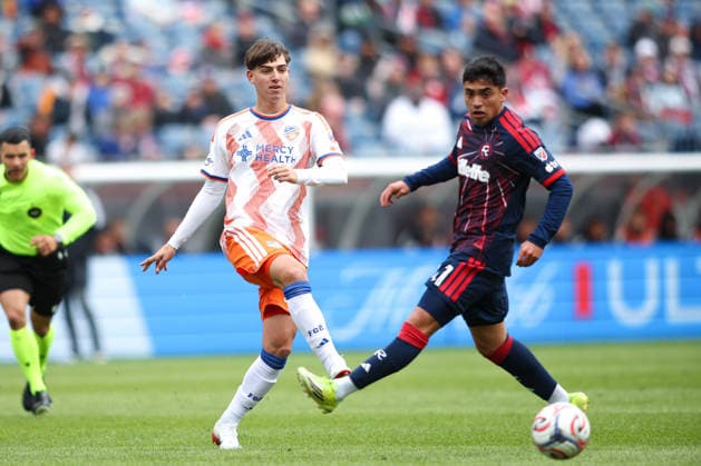 March 15, 2026; Foxborough, Massachusetts, USA; FC Cincinnati midfielder Gerardo Valenzuela (22) passes the ball past New England Revolution forward Luca Langoni (41) in a Major League Soccer game between the New England Revolution and FC Cincinnati at Gillette Stadium. (c) CSM MLS, Fussball Herren, USA 2026: FC Cincinnati Vs Revolution MAR 15  - ZUMAc04_ 20260315_zma_c04_043 Copyright: xBurtxGranofskyx