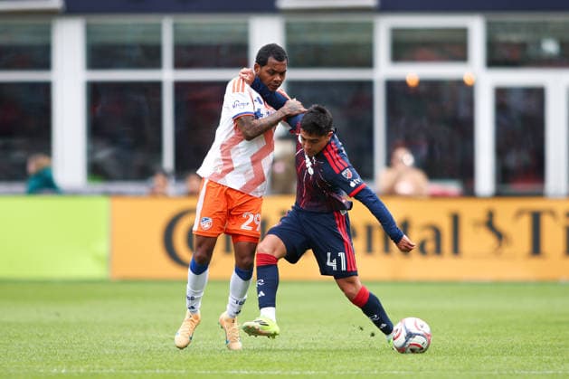 March 15, 2026; Foxborough, Massachusetts, USA; New England Revolution forward Luca Langoni (41) holds FC Cincinnati forward Bryan Ramirez (29) off the ball in a Major League Soccer game between the New England Revolution and FC Cincinnati at Gillette Stadium. (c) CSM - ZUMAc04_ 20260315_zma_c04_040 Copyright: xBurtxGranofskyx