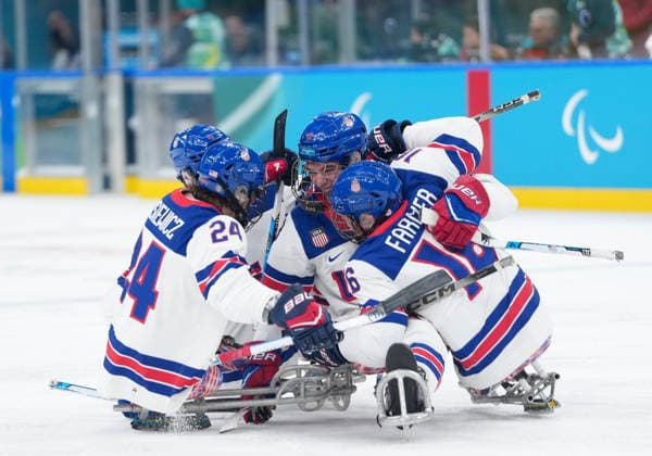 (260316) -- MILAN, March 16, 2026 -- Players of the United States celebrate a goal during the Para Ice hockey, Eishockey final match between the United States and Canada at the Milan-Cortina 2026 Paralympic Winter games, Winterspiele,Spiele, Summer games in Milan, Italy, March 15, 2026. ) (SP)ITALY-MILAN-CORTINA 2026-PARALYMPIC WINTER GAMES-PARA ICE HOCKEY-USA VS CANADA LixJing 