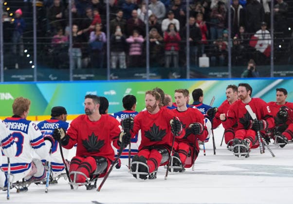 (260316) -- MILAN, March 16, 2026 -- Players of the United States and Canada salute each other after the Para Ice hockey, Eishockey final match between the United States and Canada at the Milan-Cortina 2026 Paralympic Winter games, Winterspiele,Spiele, Summer games in Milan, Italy, March 15, 2026. ) (SP)ITALY-MILAN-CORTINA 2026-PARALYMPIC WINTER GAMES-PARA ICE HOCKEY-USA VS CANADA LixJing 