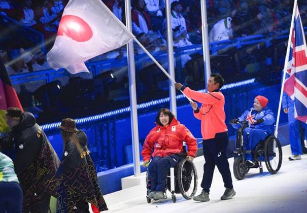 Milan Cortina Paralympics: Closing ceremony Junta Kosuda (C, R) carries the Japanese flag, accompanied by Aki Ogawa (C, L), during the closing ceremony of the Milan Cortina Paralympics at Cortina Curling Olympic Stadium on March 15, 2026, in Cortina d Ampezzo, Italy.  A14AA0005389214P