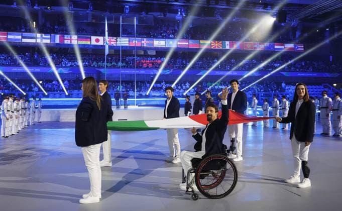 Milan Cortina Paralympics: Closing ceremony The Italian flag is carried during the closing ceremony of the Milan Cortina Paralympics at Cortina Curling Olympic Stadium on March 15, 2026, in Cortina d Ampezzo, Italy.  A14AA0005389398P