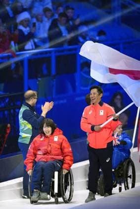 Milan Cortina Paralympics: Closing ceremony Junta Kosuda (R) carries the Japanese flag, accompanied by Aki Ogawa, during the closing ceremony of the Milan Cortina Paralympics at Cortina Curling Olympic Stadium on March 15, 2026, in Cortina d Ampezzo, Italy.  A14AA0005389414P