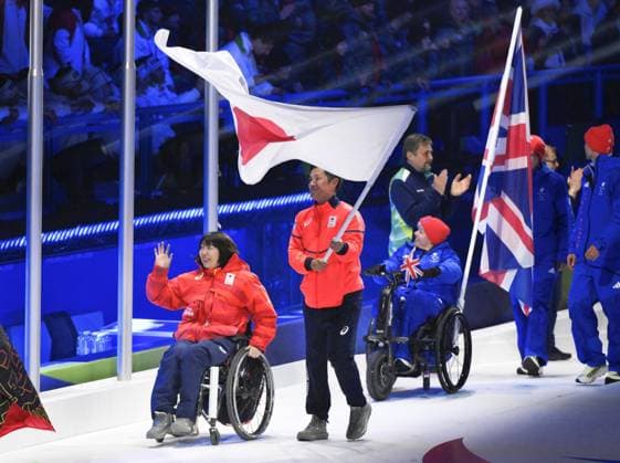 Milan Cortina Paralympics: Closing ceremony Junta Kosuda (2nd from L) carries the Japanese flag, accompanied by Aki Ogawa, during the closing ceremony of the Milan Cortina Paralympics at Cortina Curling Olympic Stadium on March 15, 2026, in Cortina d Ampezzo, Italy.  A14AA0005389420P