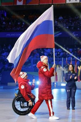 Milan Cortina Paralympics: Closing ceremony An athlete from Russia carries the Russian national flag during the closing ceremony of the Milan Cortina Paralympics at Cortina Curling Olympic Stadium on March 15, 2026, in Cortina d Ampezzo, Italy.  A14AA0005389425P