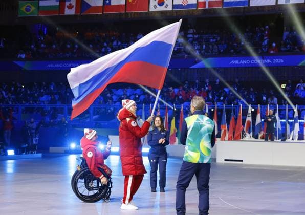 Milan Cortina Paralympics: Closing ceremony An athlete from Russia carries the Russian national flag during the closing ceremony of the Milan Cortina Paralympics at Cortina Curling Olympic Stadium on March 15, 2026, in Cortina d Ampezzo, Italy.  A14AA0005389427P