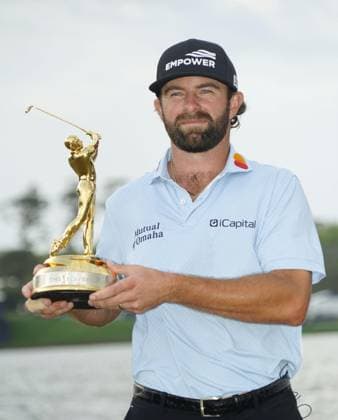 Golf: Players Championship Cameron Young of the United States is pictured with the trophy after winning the Players Championship golf tournament at TPC Sawgrass in Ponte Vedra Beach, Florida, on March 15, 2026.  A14AA0005389654P