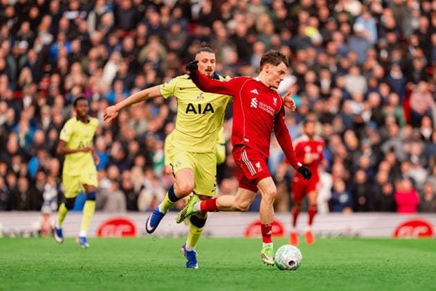 Liverpool v Tottenham Hotspur - Premier League Liverpool s Florian Wirtz in action with Radu Dragusin of Tottenham Hotspur during the Premier League match between Liverpool and Tottenham Hotspur at Anfield, Liverpool, on March 15, 2026. Liverpool Merseyside  Copyright: xMIxNewsx originalFilename:fletcher-liverpoo260315_npTfC.jpg