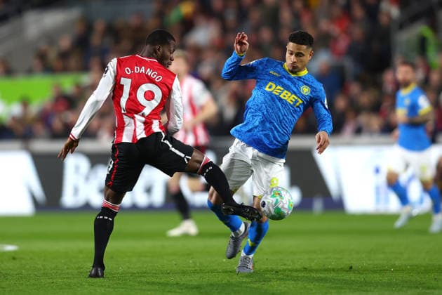 London, England, 16th March 2026. Dango Ouattara of Brentford and Joao Gomes of Wolverhampton Wanderers during the Brentford vs Wolverhampton Wanderers Premier League match at Gtech Community Stadium, London. Picture credit should read: Paul Terry Sportimage EDITORIAL USE ONLY. No use with unauthorised audio, video, data, fixture lists, club league logos or live services. Online in-match use limited to 120 images, no video emulation. No use in betting, games or single club league player publications. SPI_007_PT_Brentford_Wolves SPI-4606-0007