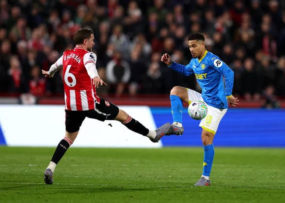 16th March 2026; Gtech Community Stadium, Brentford, London, England; Premier League Football, Brentford versus Wolverhampton Wanderers; Joao Gomes of Wolverhampton Wanderers under pressure from Mathias Jensen of Brentford  JPxFletcher Content restricted for UK based newspaper