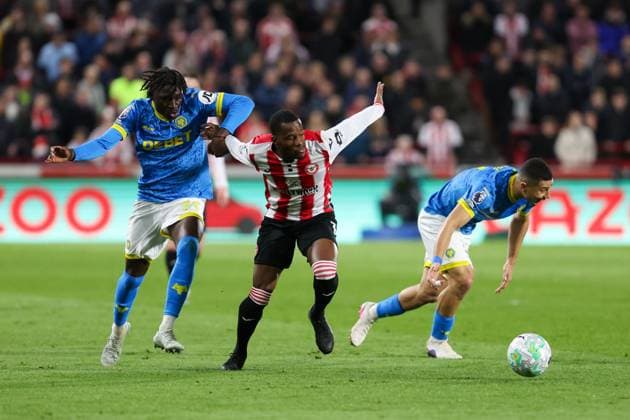 Dango Ouattara of Brentford and Mateus Manà of Wolverhampton Wanderers battle for possession Brentford v Wolverhampton Wanderers, Football, Premier League, The Gtech Community Stadium, London, UK - 16 03 2026 EDITORIAL USE ONLY No use with unauthorised audio, video, data, fixture lists (outside the EU), club league logos or live services. Online in-match use limited to 45 images (+15 in extra time). No use to emulate moving images. No use in betting, games or Copyright: xAnthonyxHanc Shutterstockx 16777223ad