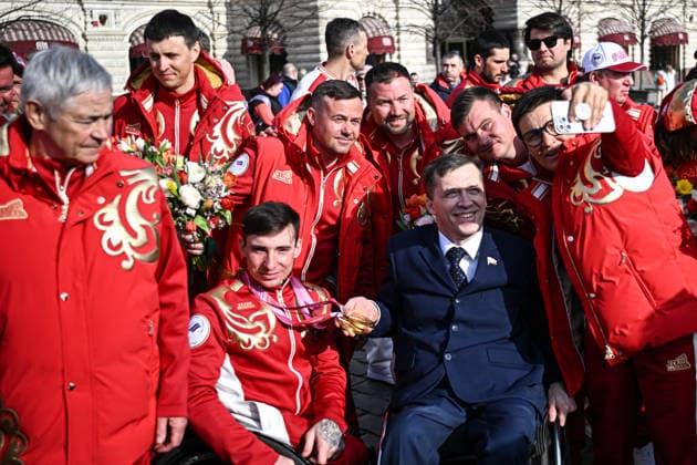 Russia Paralympics 2026 Athletes Honouring 9125592 17.03.2026 Paralympic champion in the para cross-country skiing men s 10km and 20km interval start sitting Ivan Golubkov and Chair of the Russian Union of People with Disabilities, Deputy Chair of the State Duma Committee on Labor, Social Policy and Veteran Issues Mikhail Terentyev pose during a ceremony honouring Russian athletes who took part in the Milano Cortina 2026 Winter Paralympic Games in the Red Square in Moscow, Russia. Sergey Bobylev Sputnik Moscow Russia  Copyright: xSergeyxBobylevx