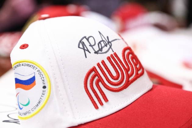 RUSSIA, MOSCOW - MARCH 17, 2026: An autographed baseball cap s seen during a press conference, PK, Pressekonferenz on the Russian team s performance at the 2026 Winter Paralympic Games, at the GUM department store. The Russian team scored third in the overall medal standings, bringing home the total of 12 medals (8 gold, 1 silver and 3 bronze). Sergei Bulkin TASS  90167563