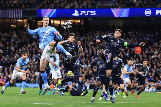 17th March 2026; Etihad Stadium, Manchester, England; UEFA Champions League Football, Manchester City versus Real Madrid; Erling Haaland of Manchester City and Fran Garcia of Real Madrid compete for the ball  DavidxBlunsden Content restricted for UK based newspaper