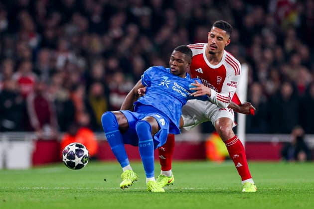 LONDON, ENGLAND - MARCH 17: Christian Kofane of Bayer 04 Leverkusen and William Saliba of Arsenal battle for the ball during the UEFA Champions League 2025 26 Round of 16 Second Leg match between Arsenal FC and Bayer 04 Leverkusen at Arsenal Stadium on March 17, 2026 in London, England.  Copyright: xRenexNijhuis MBxMediax