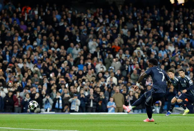 Manchester, England, 17th March 2026. Vinicius Junior of Real Madrid scoring the first goal from the penalty spot during the Manchester City vs Real Madrid UEFA Champions League round of 16 match at the Etihad Stadium, Manchester. Picture credit should read: Cody Froggatt Sportimage EDITORIAL USE ONLY. No use with unauthorised audio, video, data, fixture lists, club league logos or live services. Online in-match use limited to 120 images, no video emulation. No use in betting, games or single club league player publications. SPI_031_CF_ManCity_Madrid SPI-4612-0056