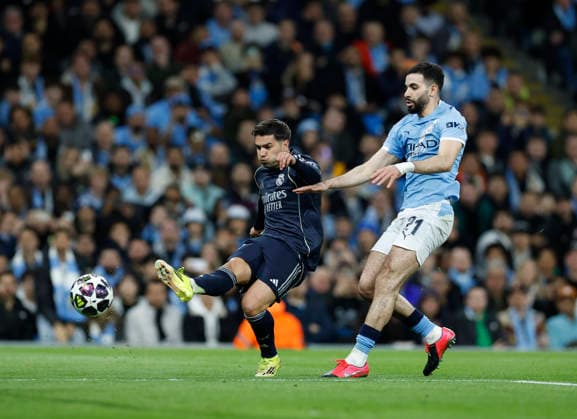 Manchester, England, 17th March 2026. Brahim Diaz of Real Madrid shoots as he gets clear of Rayan Alt-Nouri of Manchester City during the Manchester City vs Real Madrid UEFA Champions League round of 16 match at the Etihad Stadium, Manchester. Picture credit should read: Cody Froggatt Sportimage EDITORIAL USE ONLY. No use with unauthorised audio, video, data, fixture lists, club league logos or live services. Online in-match use limited to 120 images, no video emulation. No use in betting, games or single club league player publications. SPI_035_CF_ManCity_Madrid SPI-4612-0076