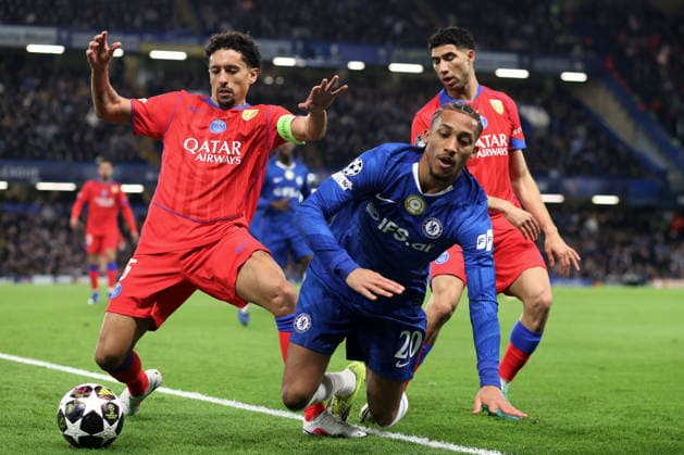 Chelsea v PSG 17 March 2026, London - UEFA Champions League, Round of Sixteen, 2nd Leg - Chelsea v Paris Saint-Germain - Joao Pedro of Chelsea goes down under pressure from Marquinhos and Achraf Hakimi of PSG - Photo: Charlotte Wilson Offside. London UK Copyright: xCharlottexWilsonx xOffsidexOffside