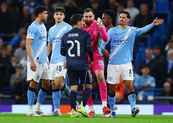 Manchester City goalkeeper Gianluigi Donnarumma and Brahim Diaz of Real Madrid Manchester City v Real Madrid, UEFA Champions League, Round of 16, Second Leg, Football, Etihad Stadium, Manchester, UK - 17 Mar 2026Manchester Etihad Stadium United Kingdom EDITORIAL USE ONLY No use with unauthorised audio, video, data, fixture lists, club league logos or live services. Online in-match use limited to 120 images, no video emulation. No use in betting, games or single club league player publications. Copyright: xMattxWest Shutterstockx 16776379an
