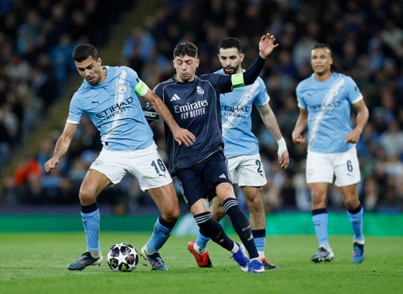 Manchester, England, 17th March 2026. Rodri of Manchester City and Federico Valverde of Real Madrid during the Manchester City vs Real Madrid UEFA Champions League round of 16 match at the Etihad Stadium, Manchester. Picture credit should read: Cody Froggatt Sportimage EDITORIAL USE ONLY. No use with unauthorised audio, video, data, fixture lists, club league logos or live services. Online in-match use limited to 120 images, no video emulation. No use in betting, games or single club league player publications. SPI_047_CF_ManCity_Madrid SPI-4612-0104