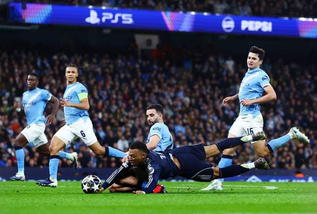 Kylian Mbappe of Real Madrid and Rayan Ait-Nouri of Manchester City Manchester City v Real Madrid, UEFA Champions League, Round of 16, Second Leg, Football, Etihad Stadium, Manchester, UK - 17 Mar 2026Manchester Etihad Stadium United Kingdom EDITORIAL USE ONLY No use with unauthorised audio, video, data, fixture lists, club league logos or live services. Online in-match use limited to 120 images, no video emulation. No use in betting, games or single club league player publications. Copyright: xMattxWest Shutterstockx 16776379bc