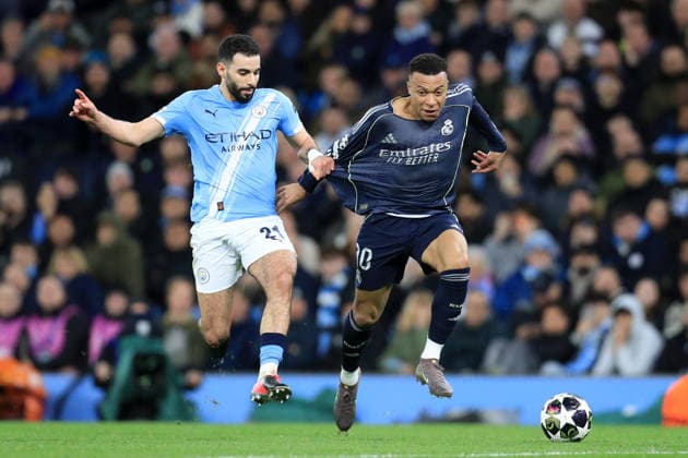 17th March 2026; Etihad Stadium, Manchester, England; UEFA Champions League Football, Manchester City versus Real Madrid; Rayan Ait-Nouri of Manchester City pulls the short of Kylian Mbappe of Real Madrid  DavidxBlunsden Content restricted for UK based newspaper