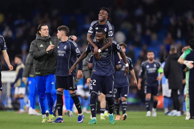 Football - UEFA Champions League - Round of 16 (2nd Leg) - Manchester City v Real Madrid 17th March 2026 - UEFA Champions League - Round of 16 (2nd Leg) - Manchester City v Real Madrid - Vinicius Junior of Real Madrid jumps on the back of Antonio Rudiger of Real Madrid as they celebrate victory after the match - Photo: Simon Stacpoole Offside. Manchester UK Copyright: xSimonxStacpoolexOffside