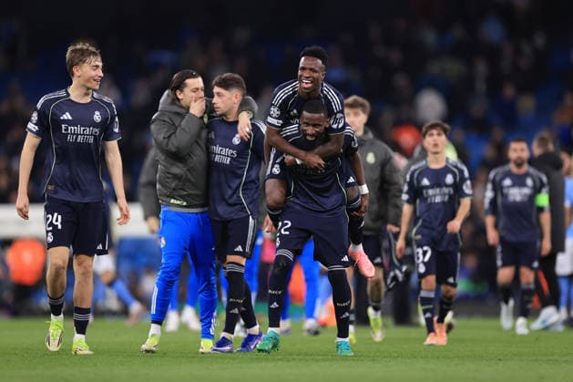 Football - UEFA Champions League - Round of 16 (2nd Leg) - Manchester City v Real Madrid 17th March 2026 - UEFA Champions League - Round of 16 (2nd Leg) - Manchester City v Real Madrid - Vinicius Junior of Real Madrid jumps on the back of Antonio Rudiger of Real Madrid as they celebrate victory after the match - Photo: Simon Stacpoole Offside. Manchester UK Copyright: xSimonxStacpoolexOffside