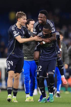 Football - UEFA Champions League - Round of 16 (2nd Leg) - Manchester City v Real Madrid 17th March 2026 - UEFA Champions League - Round of 16 (2nd Leg) - Manchester City v Real Madrid - Vinicius Junior of Real Madrid jumps on the back of Antonio Rudiger of Real Madrid as they celebrate victory with Dean Huijsen of Real Madrid (L) after the match - Photo: Simon Stacpoole Offside. Manchester UK Copyright: xSimonxStacpoolexOffside