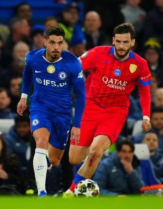 Khvicha Kvaratskhelia of PSG chases Pedro Neto of Chelsea Chelsea v Paris Saint-Germain, UEFA Champions League, Round of 16, Second Leg, Football, Stamford Bridge, London, UK - 17 Mar 2026London Stamford Bridge United Kingdom EDITORIAL USE ONLY No use with unauthorised audio, video, data, fixture lists, club league logos or live services. Online in-match use limited to 120 images, no video emulation. No use in betting, games or single club league player publications. Copyright: xJavierxGarcia Shutterstockx 16776377by