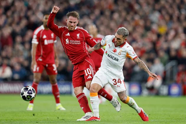 Liverpool, England, 18th March 2026. Alexis Mac Allister of Liverpool and Lucas Torreira of Galatasaray challenge for the ball during the Liverpool vs Galatasaray UEFA Champions League round of 16 match at Anfield, Liverpool. Picture credit should read: Cody Froggatt Sportimage EDITORIAL USE ONLY. No use with unauthorised audio, video, data, fixture lists, club league logos or live services. Online in-match use limited to 120 images, no video emulation. No use in betting, games or single club league player publications. SPI_030_CF_Liverpool_Galatasaray SPI-4618-0030