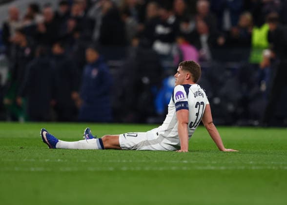 18th March 2026; Tottenham Hotspur Stadium, London, England; UEFA Champions League Football, Tottenham Hotspur versus Atletico Madrid; Micky van de Ven of Tottenham Hotspur sitting on the pitch disappointed after the match  JPxFletcher