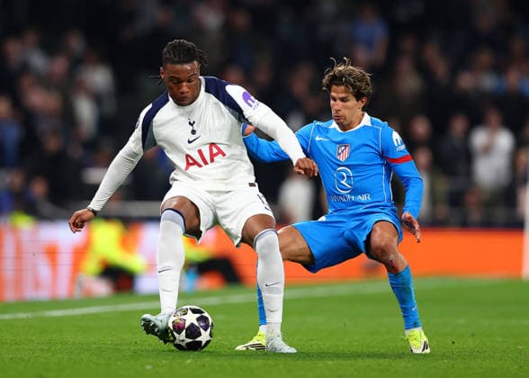 18th March 2026; Tottenham Hotspur Stadium, London, England; UEFA Champions League Football, Tottenham Hotspur versus Atletico Madrid; Destiny Udogie of Tottenham Hotspur under pressure from Giuliano Simeone of Atletico Madrid  JPxFletcher
